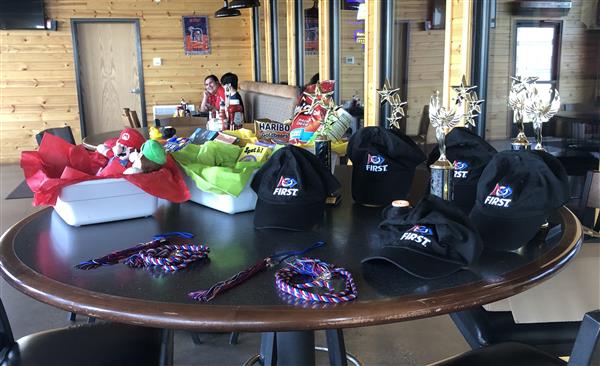 Goodie baskets, trophies and graduation cords from the Annual Banquet.