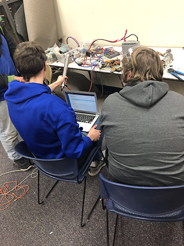 Mentor and student at computer work station.