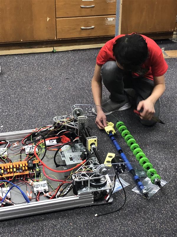 Student working on intake for robot