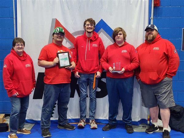 Students with trophy.